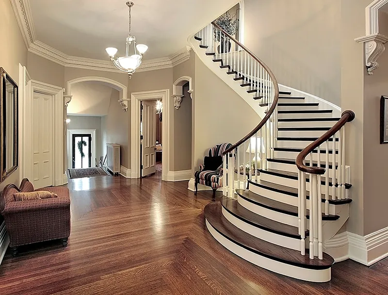 Staircase-Remodeling Curved staircase in foyer | Select Floors
