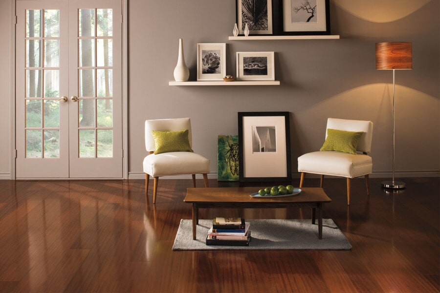 Dark brown laminate flooring in a room with two chairs and a table by Select floors in Marietta, GA | Select Floors