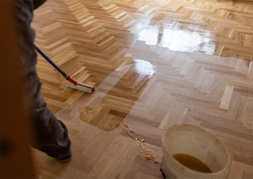 someone cleaning hardwood flooring