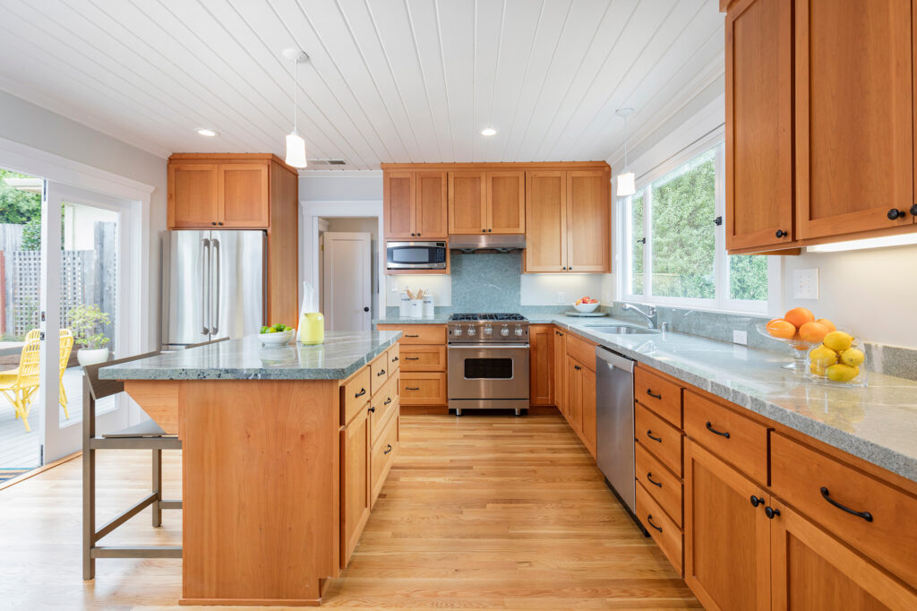 custom designed kitchen with hardwood flooring and matching wood cabinets