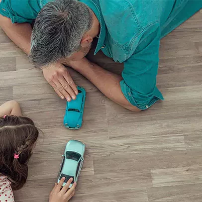 parent and child playing on a vinyl floor | Select Floors